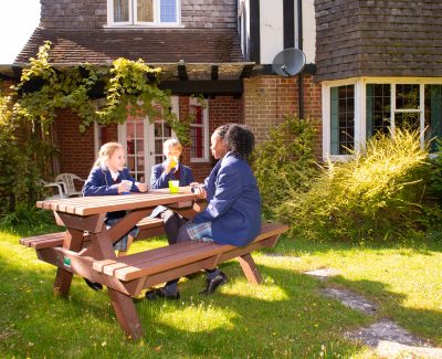 Rookwood School boarding students sat together on bench