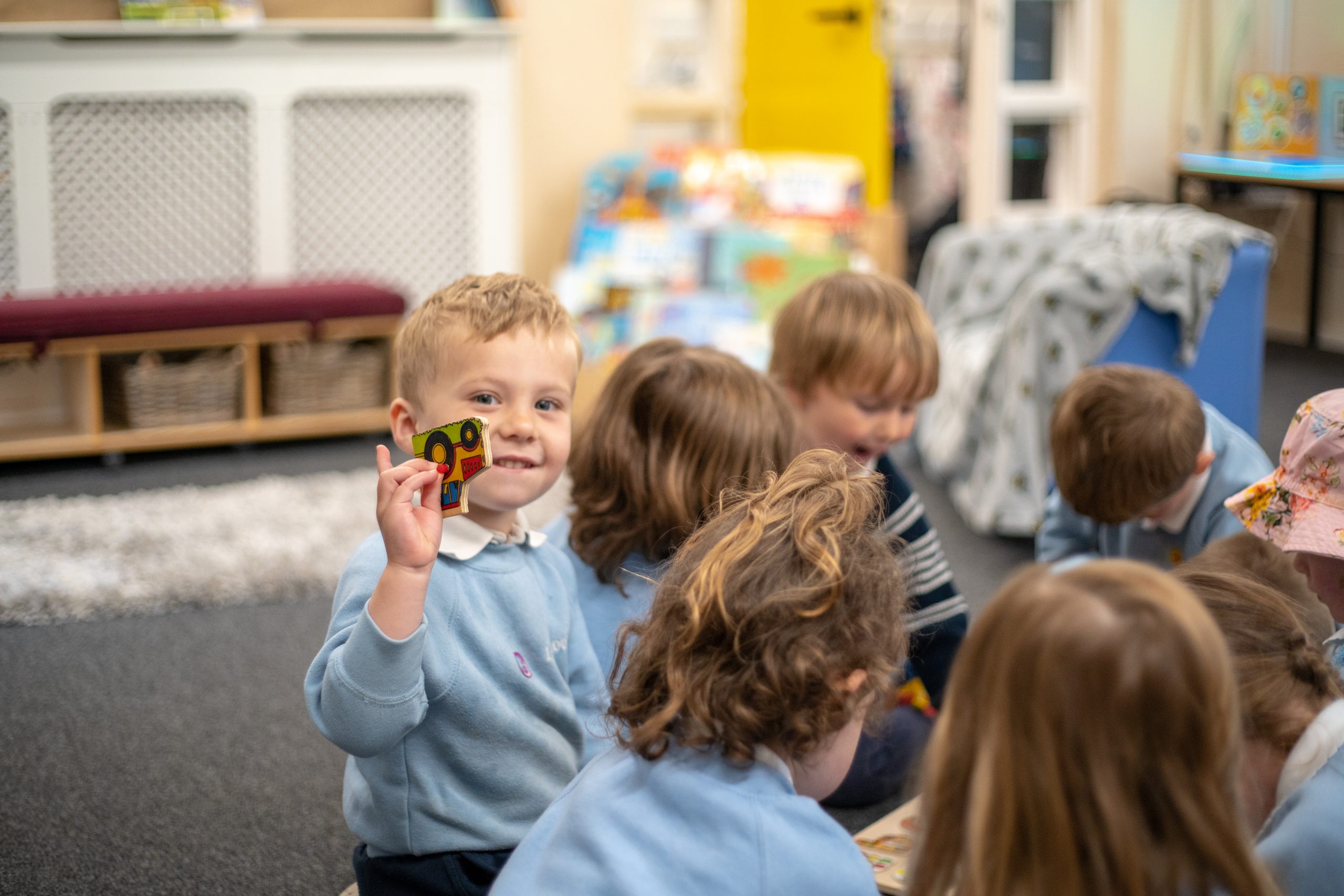 Rookwood Nursery pupil holding puzzle piece