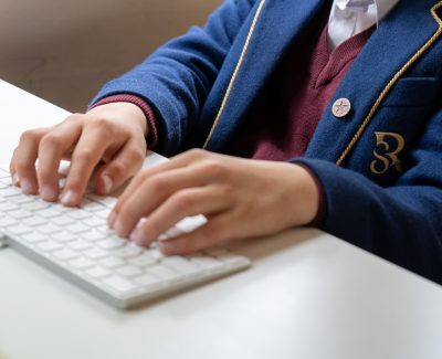 Rookwood Private School student typing on a computer keyboard