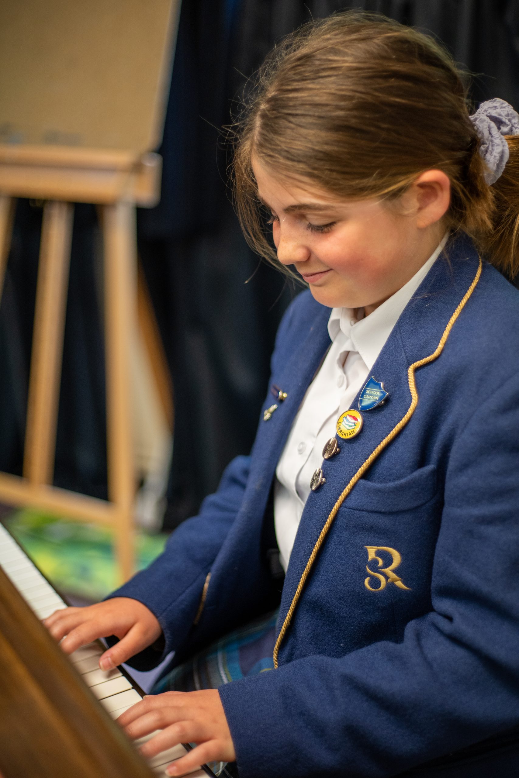 Rookwood lower school student playing the piano