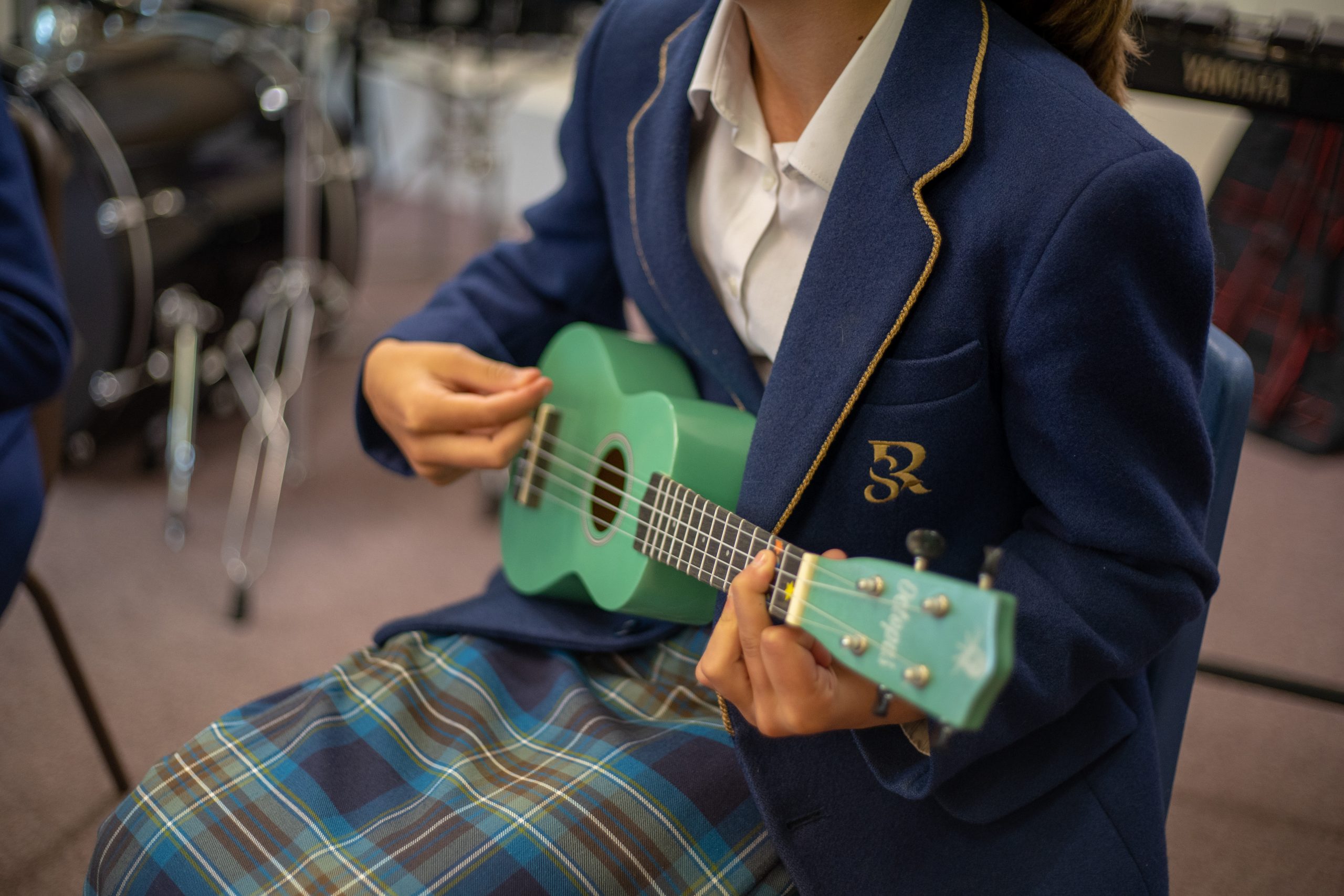 Rookwood School student playing the ukulele