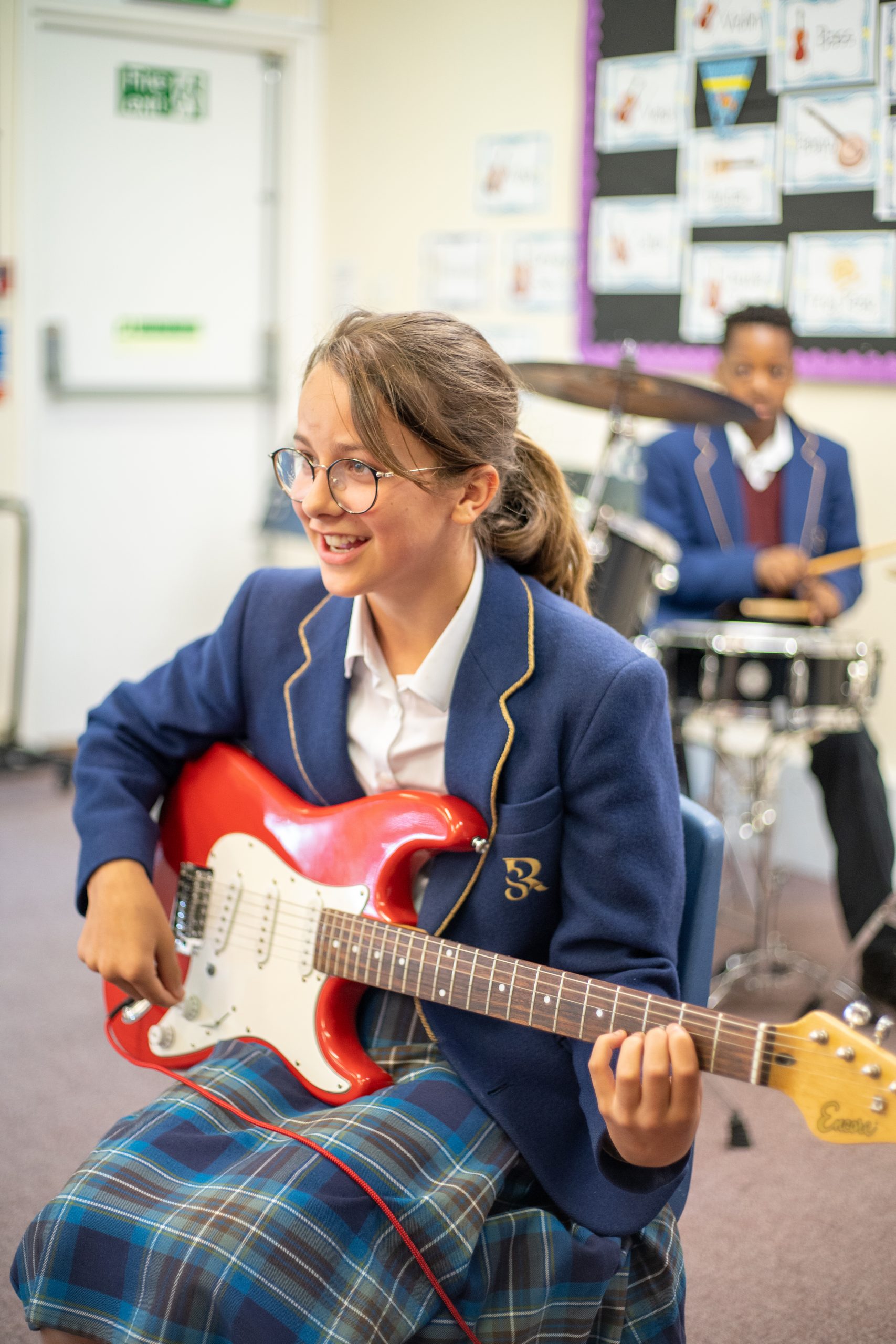 Rookwood School student playing an electric guitar