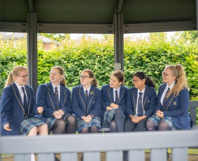 A group of Rookwood School students sat on a bench outside