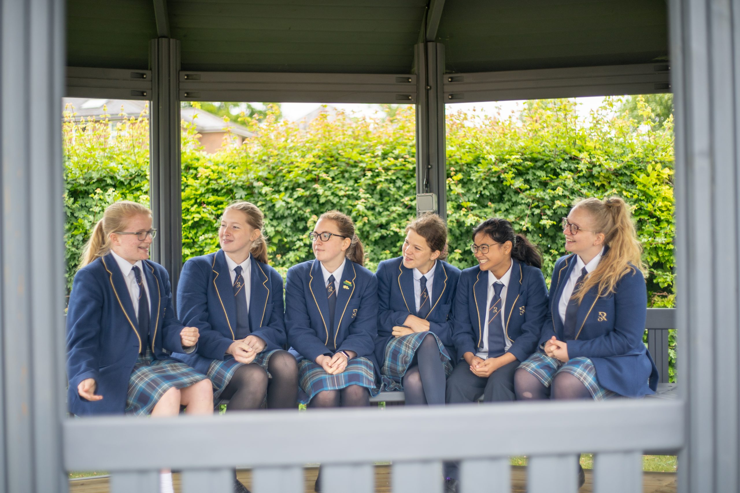 A group of Rookwood School students sat on a bench outside