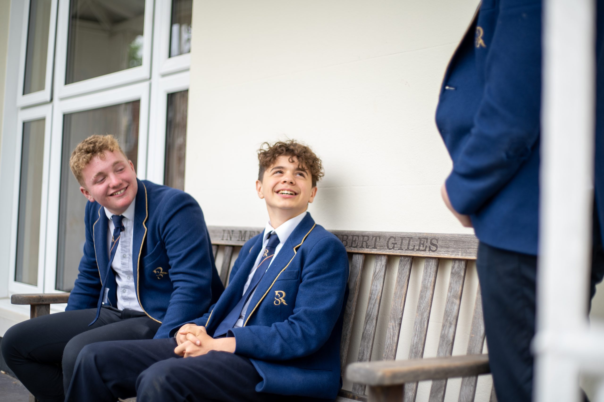 Rookwood senior school students talking to one another on an outside bench