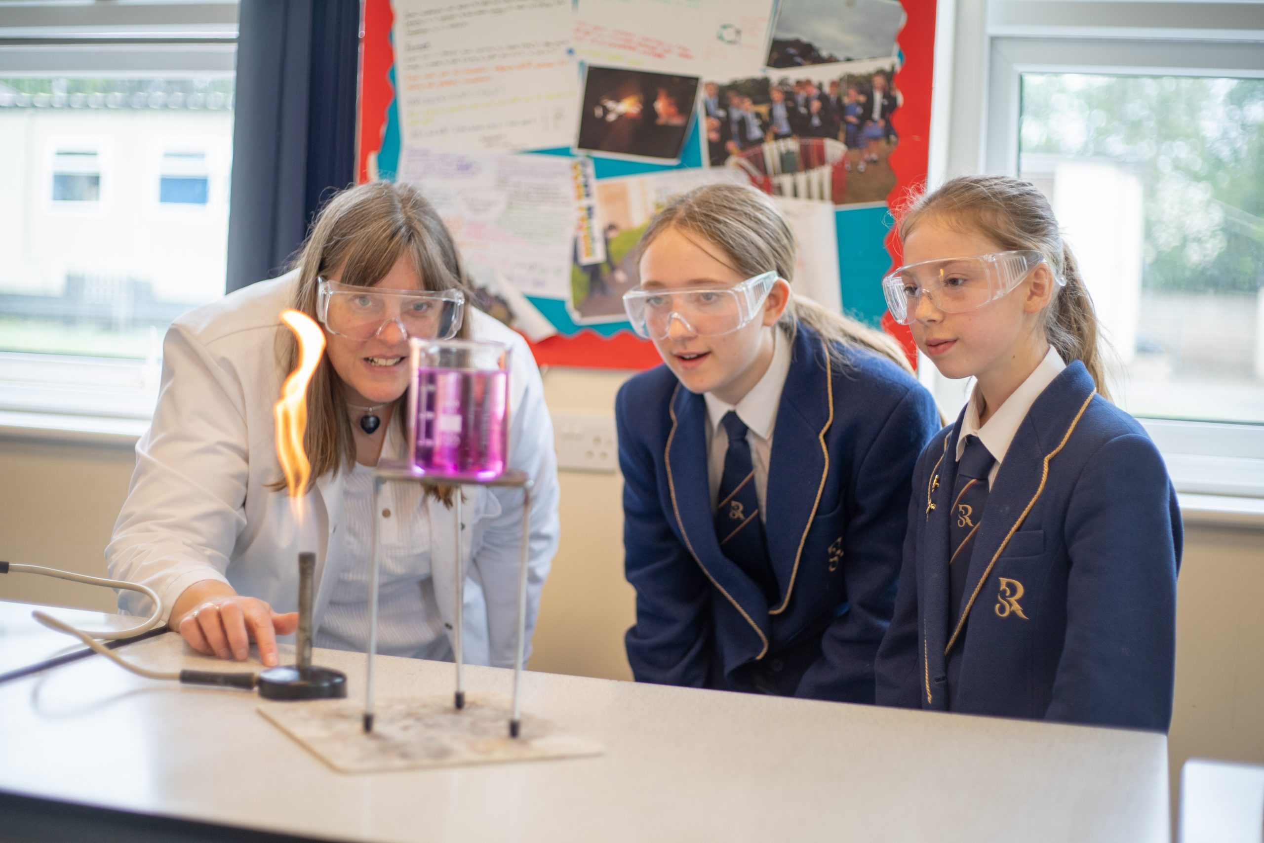 Rookwood School students watching teacher perform a lesson using a bunsen burner