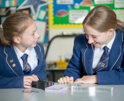 Rookwood School students laughing while completing a task in class