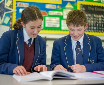 Rookwood private school students reading a book in class