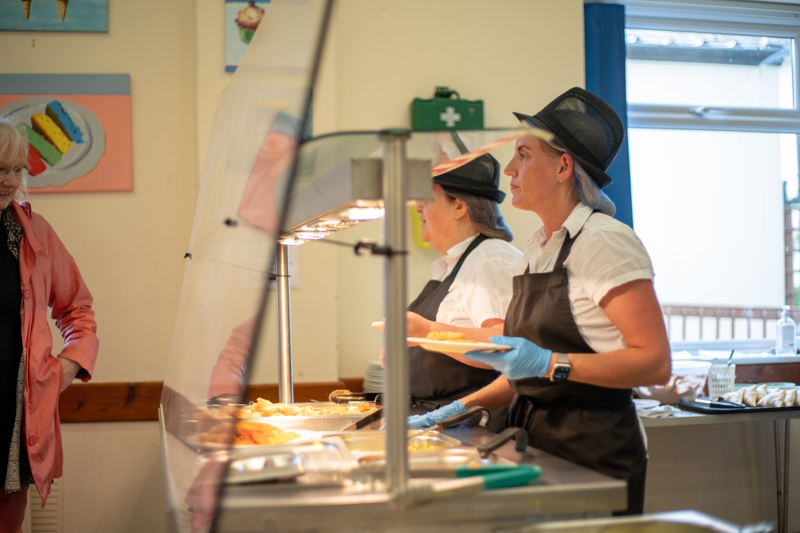 Rookwood School cafeteria staff plating up food